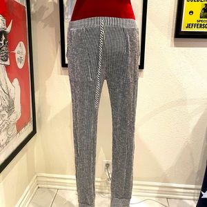 Caution to the wind. Black and white pants